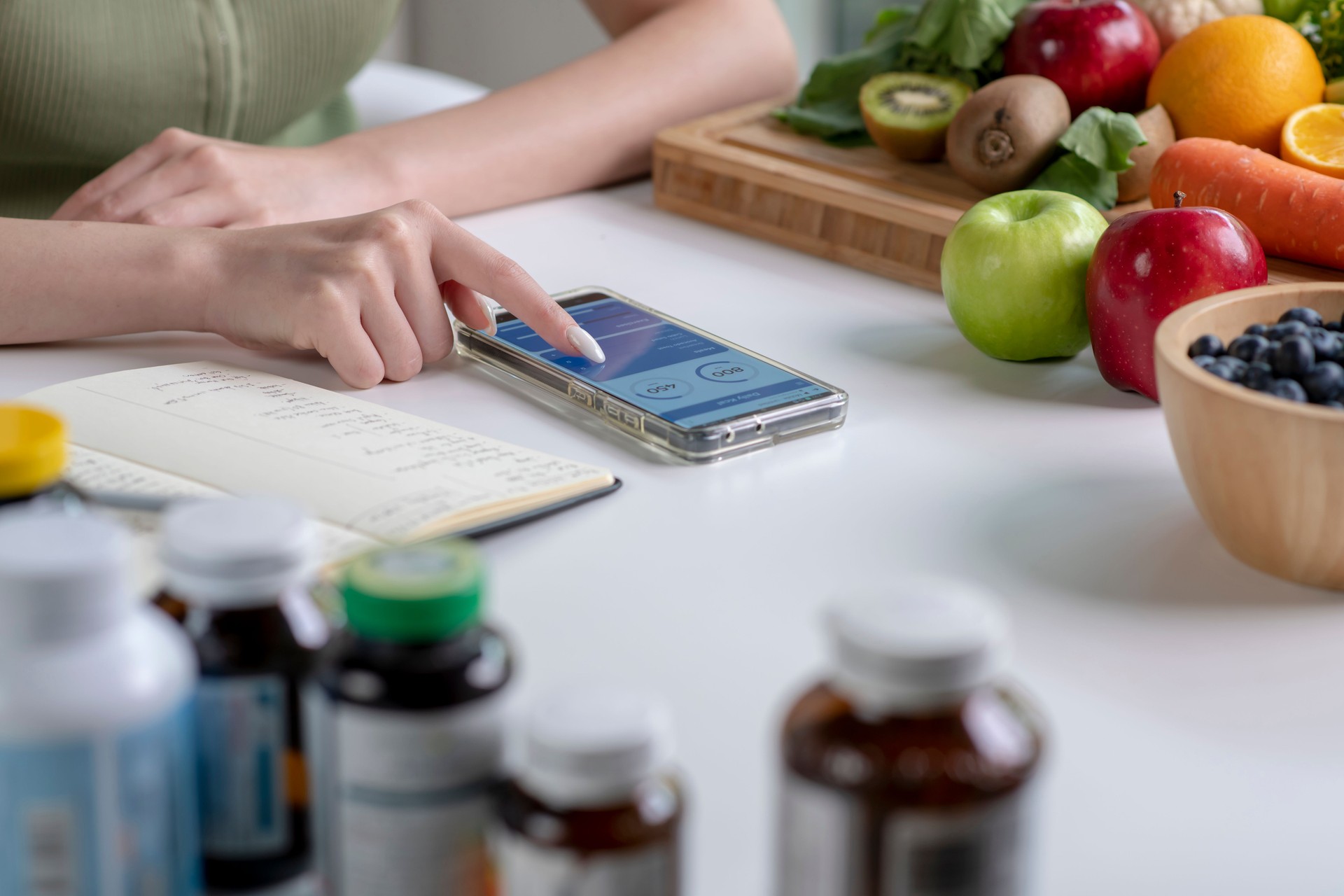 Nutritionist checking data from a smartphone